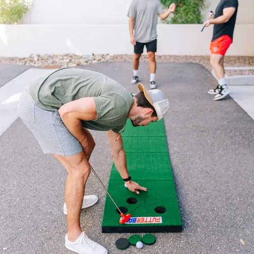 Vista 5 de PutterBall Original Golf Putting Game Set – Backyard 12 ft Putting Green Pong Style Golf Mat with 2 Putters, 2 Balls & Hole Covers