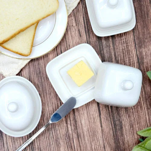 Vista 7 de NAGU Mini plato de mantequilla ovalado con tapa, plato de queso blanco con forma de procelain abovedado con asa, bandeja de mantequilla pequeña