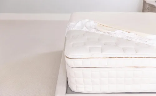 Vista 3 de Naturepedic Protector de colchón orgánico impermeable – Funda de colchón de punto elástico ajustable lavable y reutilizable – Almohadillas