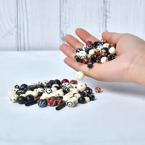 Vista 3 de Surtido de cuentas de hueso talladas a mano para hacer joyas y manualidades, 130 piezas, cuentas naturales africanas y nativas americanas en negro