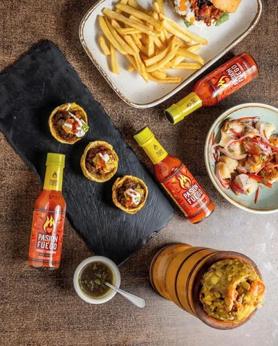 Vista 3 de Pasion por el Fuego Papaya caribeña y salsa picante habanero 5.1 onzas líquidas (5.1 fl oz), botella de vidrio, pasteurizada (paquete de 2)