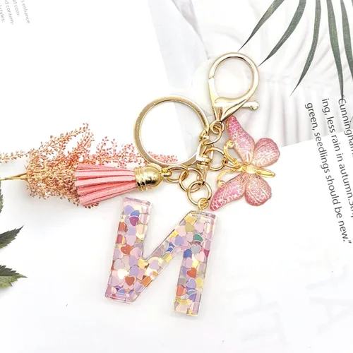 Vista 4 de OKAICEN Llavero con letra inicial del alfabeto, borla y mariposa, colgante para bolsos, mujeres y niñas