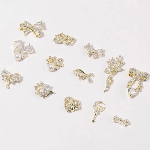Vista 2 de Dijes y gemas para uñas, circonita de cobre dorado, múltiples formas 3D, diamantes de imitación de metal de lujo para uñas, 14 piezas 13 dijes