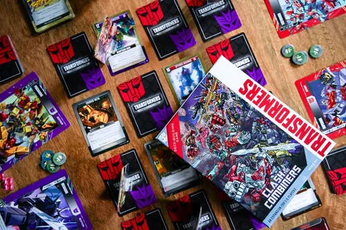 Vista 6 de Renegade Game Studios Transformers Deck Building Juego Choque de la Expansion for 1-5 Players Featuring 6 Giant-Sized Cards and 75 New Strategy