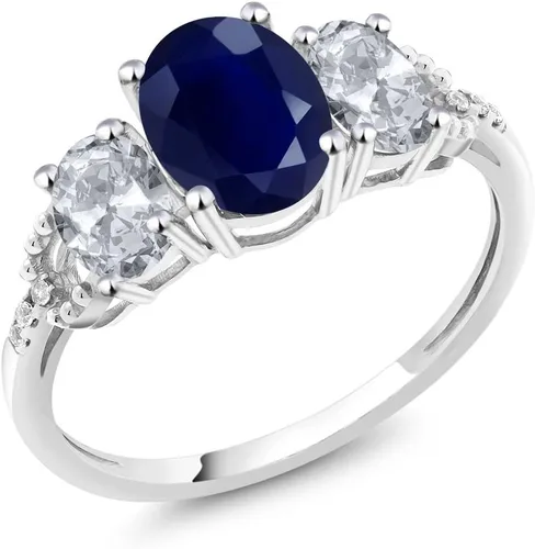 Vista 28 de Anillo de compromiso ovalado de oro blanco de 10 quilates con piedra natal y topacio blanco de 3 piedras con detalles de diamante Centro de 0.315