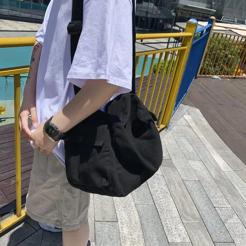 Vista 3 de Aktudy Bolso bandolera de lona para mujeres y hombres, bolso bandolera grande con múltiples bolsillos para parejas