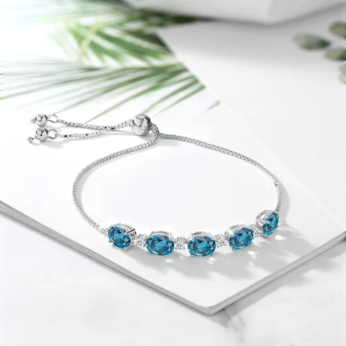 Vista 4 de Gem Stone King Pulsera de tenis de plata de ley 925 con topacio azul Londres y topacio blanco para mujer