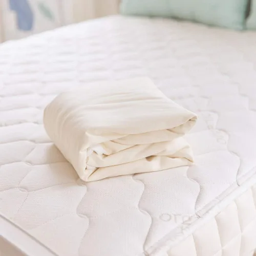 Vista 4 de Naturepedic Protector de Colchón Impermeabilizante Orgánico - Funda de Colchón Elástica Lavable y Reutilizable Ajustada - Almohadillas para Cama