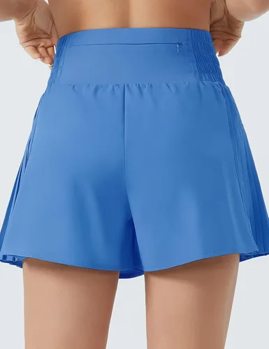 Vista 4 de THE GYM PEOPLE Pantalones cortos de entrenamiento de cintura alta para mujer, plisados laterales, pantalones cortos deportivos con forro de malla