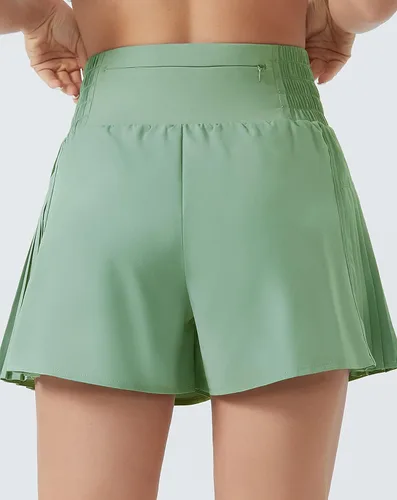 Vista 4 de THE GYM PEOPLE Pantalones cortos de entrenamiento de cintura alta para mujer, plisados, con forro de malla y bolsillo con cremallera