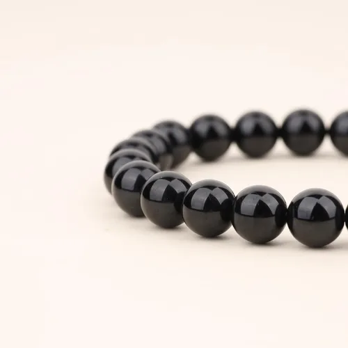 Vista 6 de COAI Pulsera Hamsa de piedra turmalina negra con dije de mano