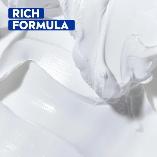 Vista 4 de NIVEA Crema hidratante para el cuerpo, la cara y las manos, fórmula alemana, rica crema hidratante corporal con provitamina B5, lata de 8.4 onzas