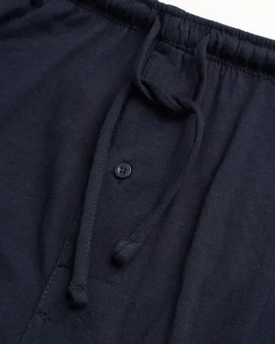 Vista 4 de Reebok Pantalones deportivos para hombre - Pantalones deportivos ligeros de ajuste clásico con parte inferior abierta (S-XL)
