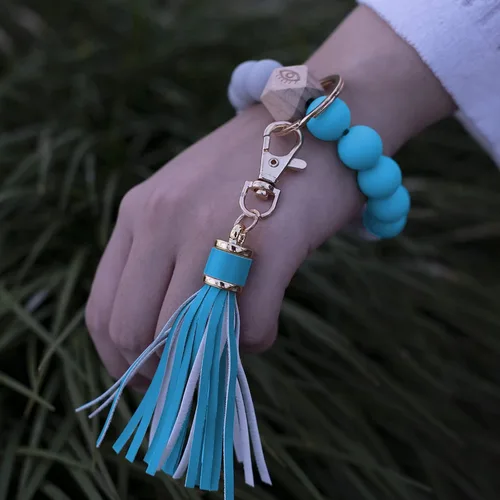 Vista 6 de Llavero de silicona para mujer con cuentas de llavero de pulsera portátil de borla de coche