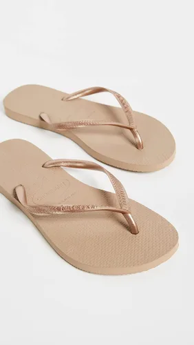 Vista 2 de Havaianas - Sandalia delgadas con diseño de la Mujer Maravilla para mujer, Oro Rosa