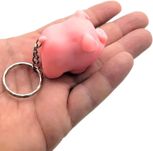 Vista 5 de Naughty Squeeze Pooping - Llavero de cerdo rosa (2") Animal Poop TURD