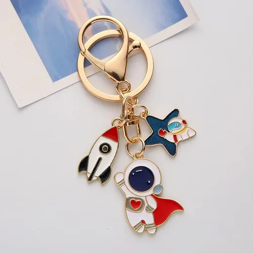 Vista 2 de Llavero con colgante de cohete de astronauta, llavero de metal, bolso con dije, organizador de llaves, regalo de Navidad, cumpleaños, llavero