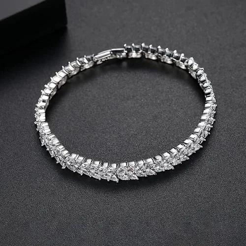 Vista 4 de Pulsera de tenis de cristal de oro de 14 quilates para mujer, diseño de hojas delicadas, bisel con bisel y ajuste de cristal natural, regalo