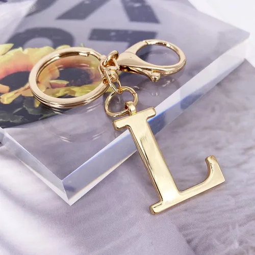 Vista 2 de Llavero de letra A-Z dorado para mujeres y hombres, bolso de mano de metal con letra inicial del alfabeto