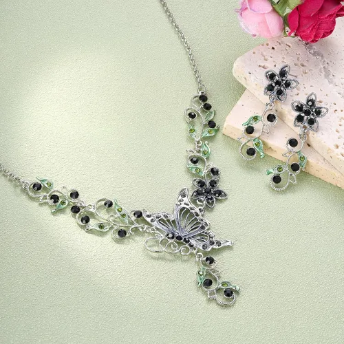 Vista 6 de EleQueen Conjunto de collar y pendientes de mariposa, flor y hoja de cristal austriaco para mujer Negro