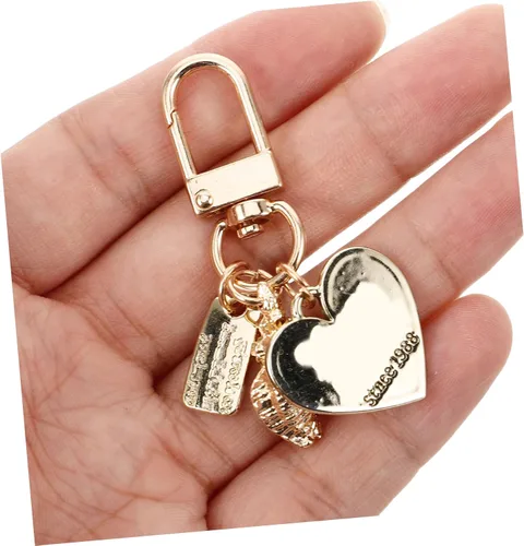 Vista 4 de Llavero con forma de concha para niñas, regalo para mujer, con forma de corazón de perla