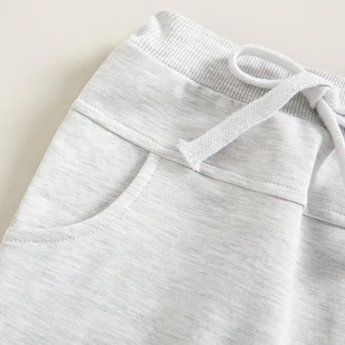 Vista 6 de Mubineo Pantalones deportivos básicos lisos para bebés, niños y niñas, cómodos pantalones de algodón con bolsillos