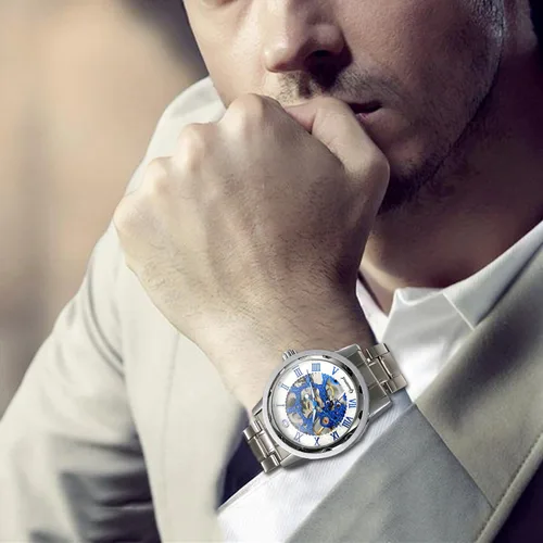 Vista 6 de Jewelrywe - Reloj de pulsera mecánico para hombre y hombre, esfera azul esqueleto, correa de acero inoxidable, mecanismo de viento a mano