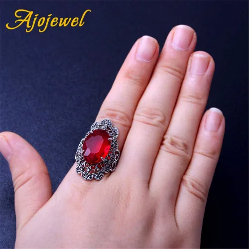 Vista 4 de Anillos grandes ovalados de cristal rojo para las mujeres ahuecan hacia fuera flor diseño dedo joyería vintage anel