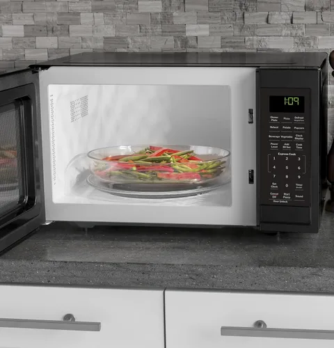 Vista 4 de [Usado] GE Horno microondas para encimera, compacto de 0.9 pies cúbicos, capacidad de 900 vatios, 7 ajustes de cocción automática, tecnología