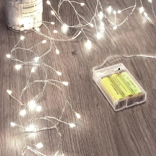 Vista 15 de Luces de hadas que funcionan con pilas, luces de cuerda centelleantes impermeables con cable plateado de 5 pies y 60 LED, luces de fuegos