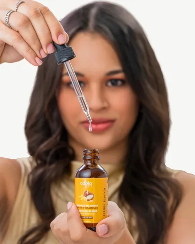 Vista 5 de Capilo Aceite Pro de Argán y Vitamina E - Hidratación profunda y Reparación del Cabello - 2 oz