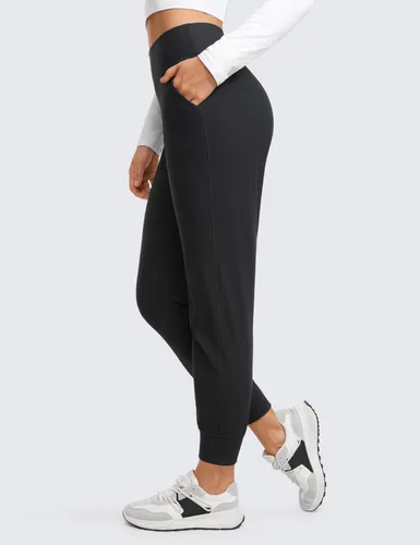 Vista 3 de CRZ YOGA Pantalones deportivos de entrenamiento con forro polar para mujer con bolsillos de 27.5 pulgadas, pantalones de senderismo y correr al aire