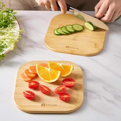 Vista 4 de Inicio Mini tabla de cortar pequeña tabla de cortar frutas tablero de madera de bambú sólido para dormitorio infantil bebé conjunto de 2