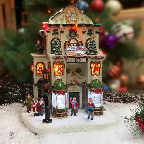 Vista 2 de MOMENTS IN TIME Tienda de Joyería Fina11”H Pueblo Navideño Iluminado con Edificio de Luces LED y Música de Navidad Decoración Festiva de Poliresina
