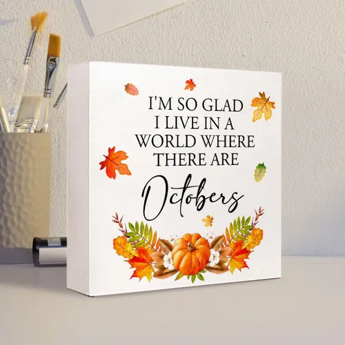 Vista 4 de Decoración de mesa de otoño, con texto en inglés "I'm so Glad I Live in a World Where There are Octobers", letrero de madera rústica, hojas