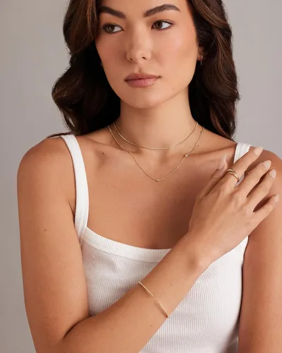 Vista 4 de PAVOI Pulsera chapada en oro de 14 quilates con circonita cúbica Elegantes pulseras de circonita cúbica para mujer