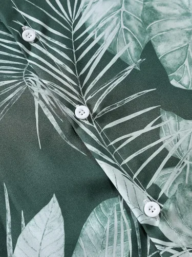 Vista 4 de OYOANGLE Camisa hawaiana de manga corta con botones y estampado tropical para hombre