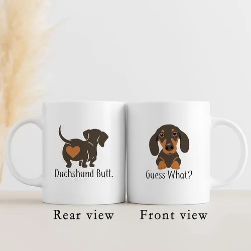 Vista 2 de QUICQOD Taza divertida de perro salchicha para mamá y amantes, taza de café blanca, adivina qué trasero de 11 onzas, regalo de Navidad, Acción