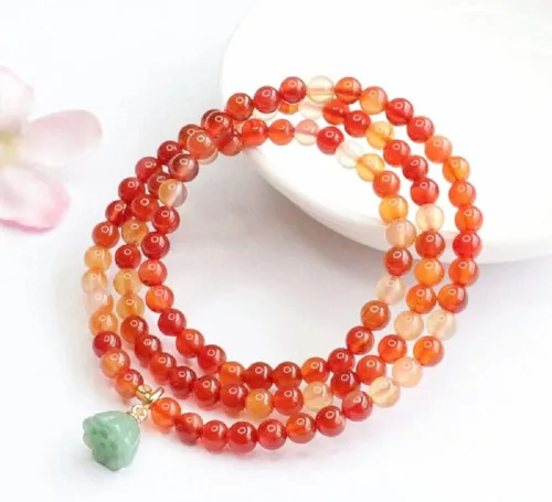 Vista 3 de YinZhiBoo Pulsera de cuentas de ágata roja natural con corona, cristal
