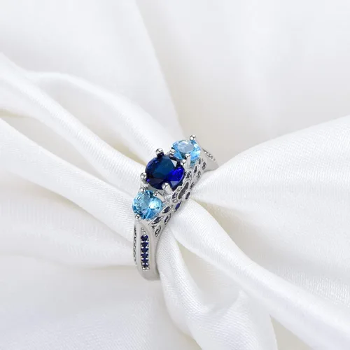 Vista 3 de Creative Fashion - Anillo de plata 925 brillante con tres piedras y zafiro con piedra natal de aguamarina azul, anillo de compromiso de eternidad