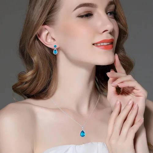 Vista 2 de VONSSY Aretes colgantes de gota Aretes hipoalergénicos de circonita cúbica chapados en oro blanco con piedras preciosas en forma de gota de agua