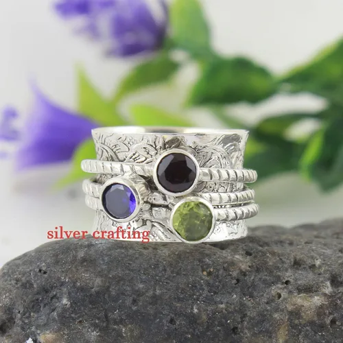 Vista 2 de Anillo giratorio de plata de ley con piedra preciosa de peridoto y granate