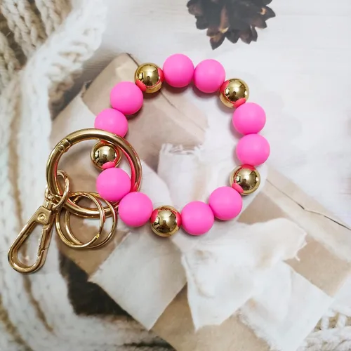 Vista 6 de Junyuerly Llavero de pulsera con cuentas de silicona para mujer, pulsera elástica con clip dorado