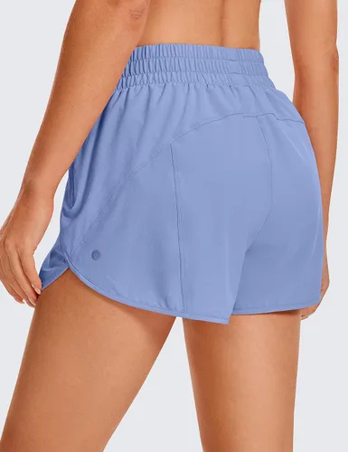 Vista 2 de CRZ YOGA Pantalones cortos para correr para mujer, talle alto, con bolsillo con cremallera, forro de malla, entrepierna de 3 pulgadas, dobladillo