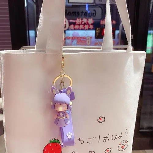 Vista 4 de Llavero kawaii con diseño de dibujos animados bolsa con colgante para decoración de mochila llavero de coche para niña y mujer