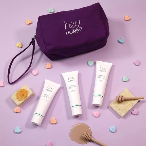 Vista 2 de Hey Honey Set de 4 piezas: Loción para el cuerpo, crema para pies Walk The Walk, crema de manos con miel, bolsa de maquillaje ecológica. Perfecto