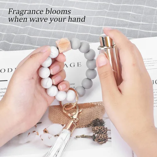Vista 4 de Weixiltc Llavero para mujer, pulsera de cuentas de silicona, llavero con borla de cuero