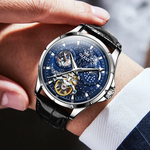 Vista 2 de OLEVS Reloj para hombre, esfera de cielo estrellado, Universo de Vía Láctea, cuerda automática, correa de cuero azul, vestido de moda, impermeable