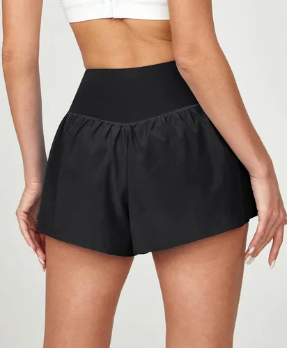 Vista 2 de Ewedoos Pantalones cortos deportivos cruzados fluidos para mujer con 3 bolsillos 2 en 1, pantalones cortos de mariposa de cintura alta para correr