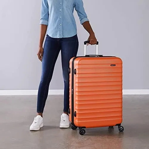 Vista 6 de Tienda Basics Maleta rígida giratoria, equipaje de mano expandible con ruedas, Naranja, Spinner